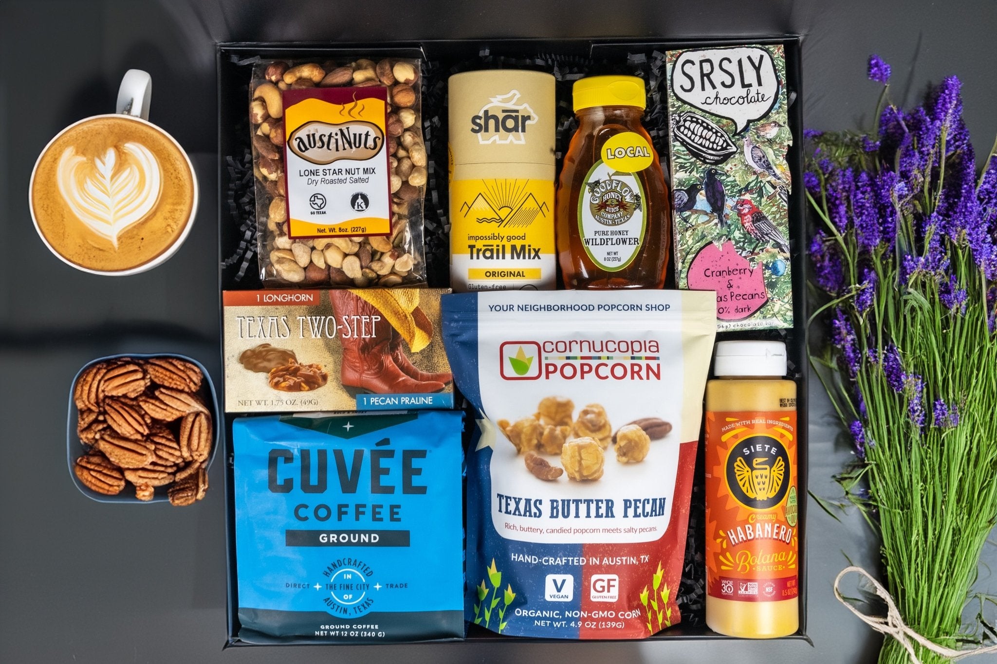 Austin Texas gift basket featuring gourmet popcorn, coffee, chocolate, honey, and local treats.