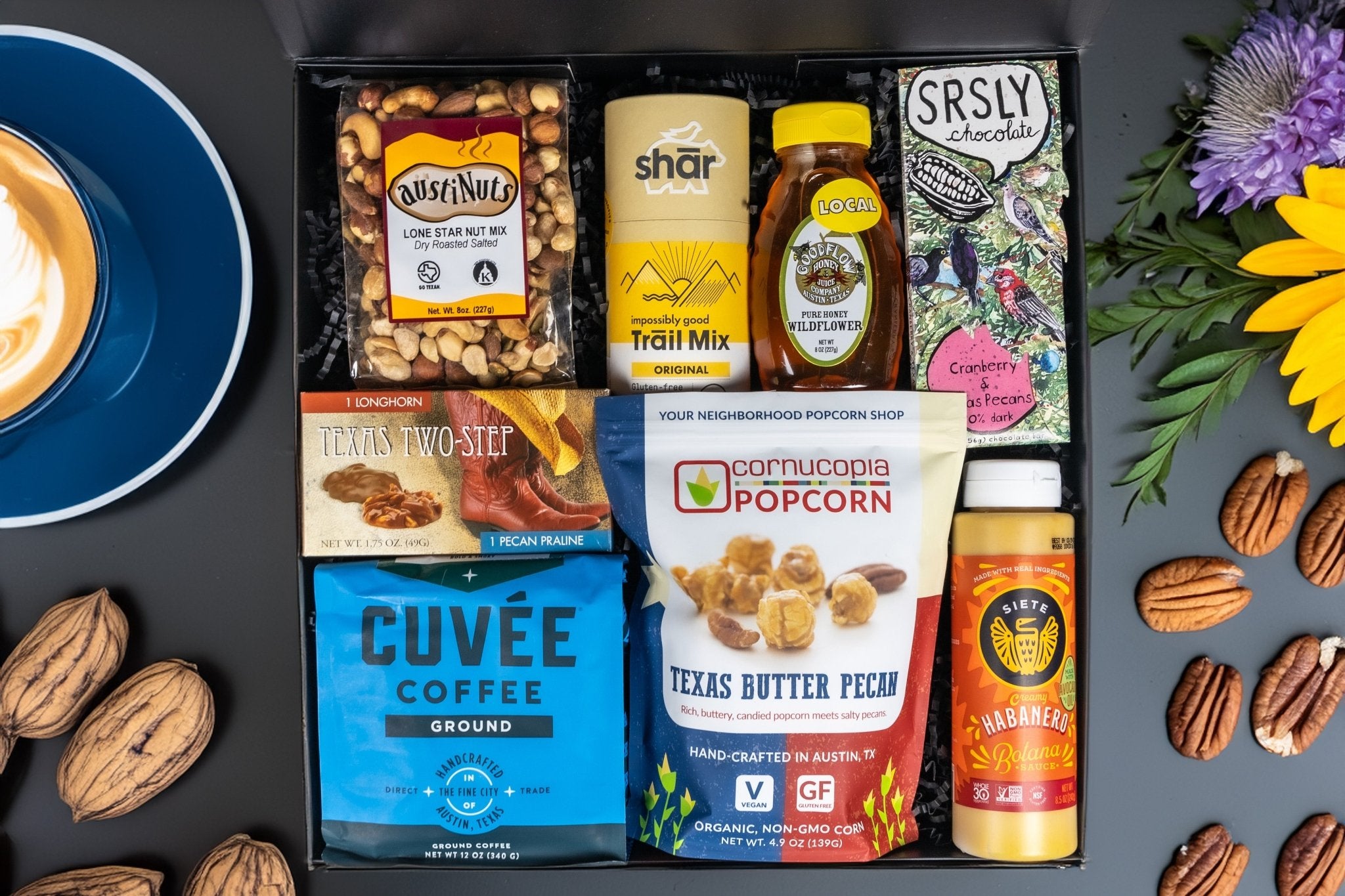 Gift Basket Austin with Texas popcorn, chocolate, trail mix, coffee, honey, and artisan snacks.”