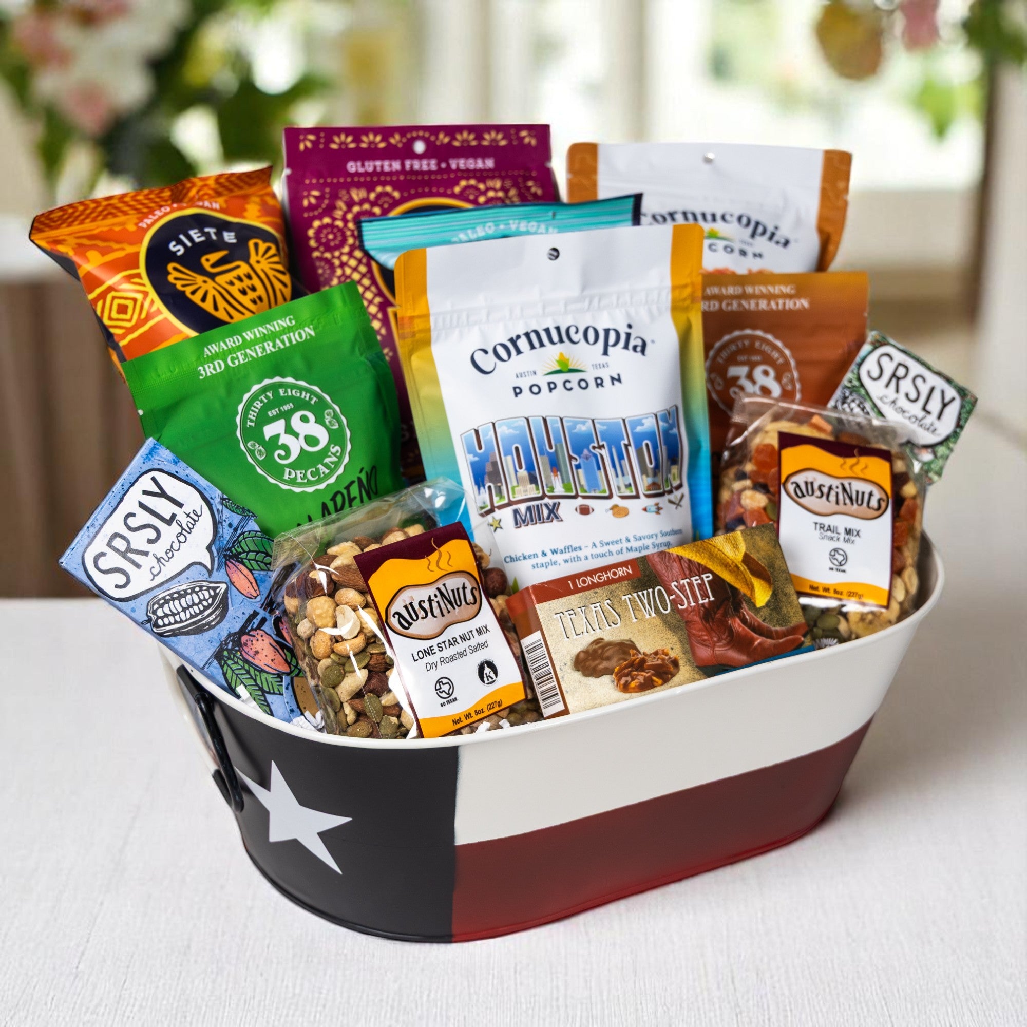 Houston gift basket packed with Texas pecans, small-batch chocolate handcrafted in Texas, trail mix and local snacks